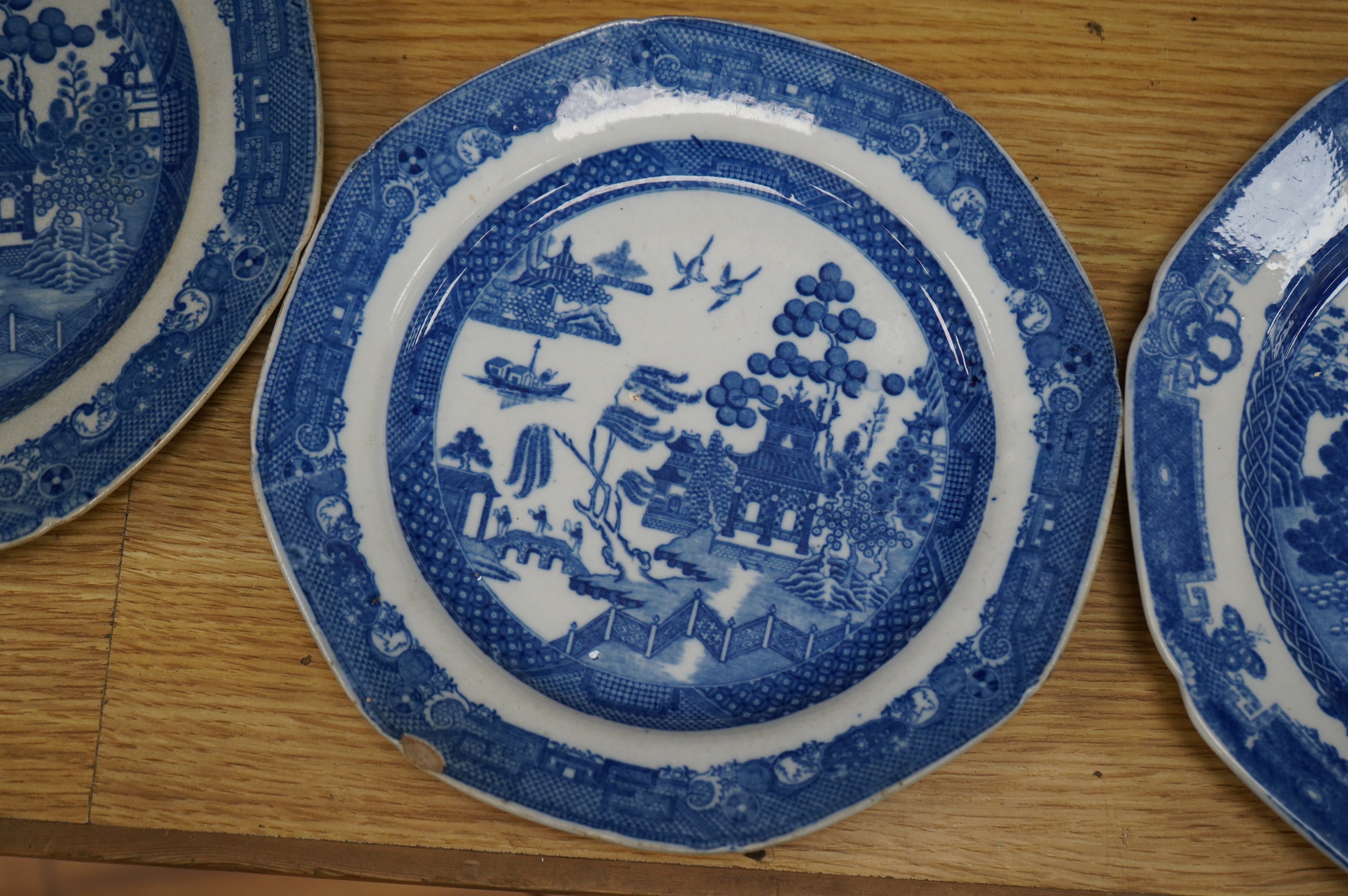 Four early 19th century English pearlware blue and white plates, largest 23.5cm. Condition - fair